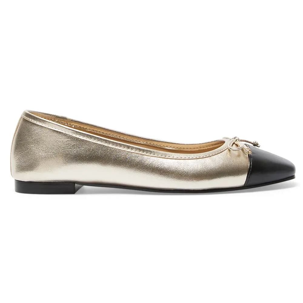 Trella Flat in Black And Gold Leather